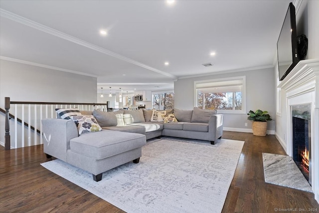 living room featuring ornamental molding and dark wood-type flooring