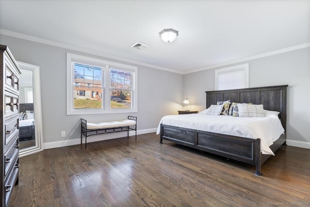 bedroom with dark hardwood / wood-style flooring and crown molding