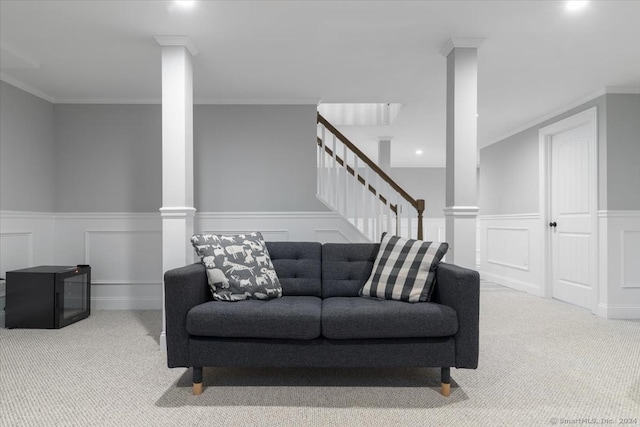 living room featuring light carpet and crown molding