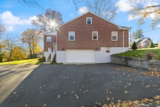 view of property exterior with a garage