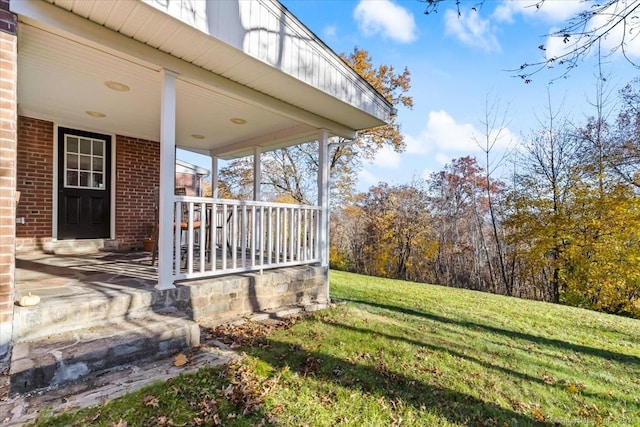 view of yard with covered porch