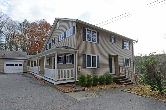 view of front of property featuring a garage and covered porch