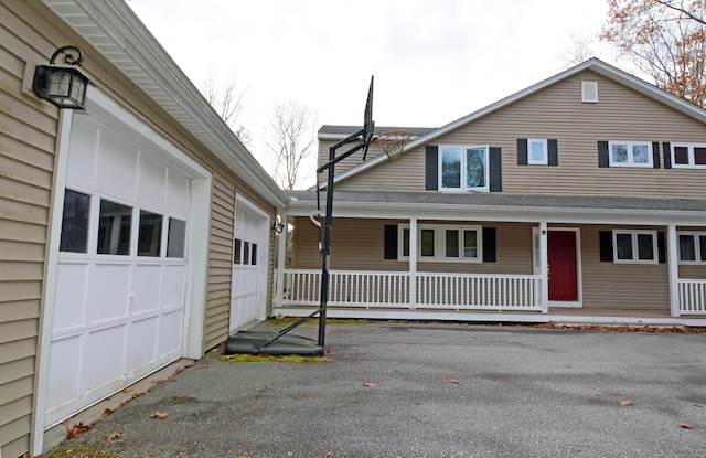 view of front of home featuring a garage and covered porch