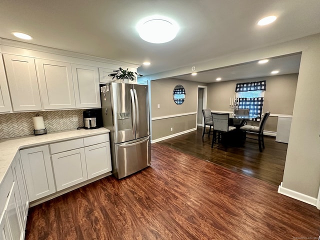 kitchen with backsplash, stainless steel fridge with ice dispenser, dark hardwood / wood-style floors, and white cabinets