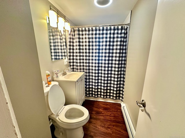 bathroom featuring hardwood / wood-style flooring, baseboard heating, toilet, vanity, and curtained shower