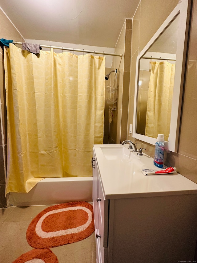 bathroom featuring vanity and shower / bath combo with shower curtain