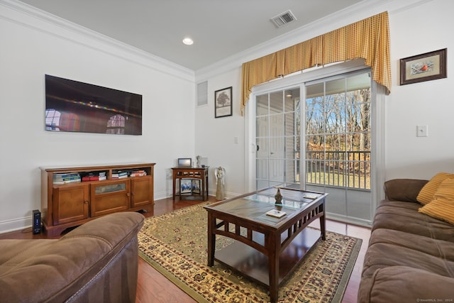 living room with wood-type flooring and crown molding