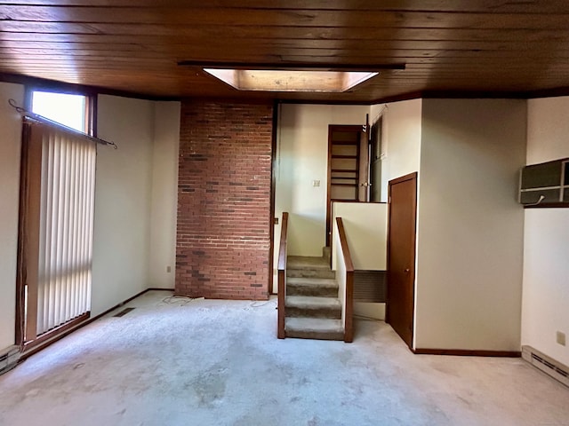 interior space featuring light carpet, wooden ceiling, and a baseboard radiator