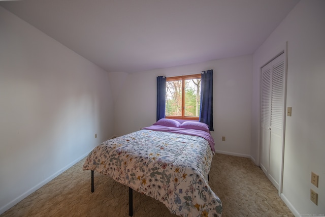 carpeted bedroom featuring a closet