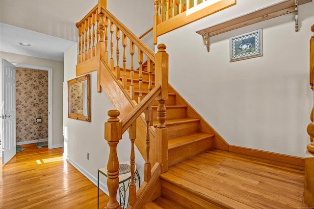 stairway featuring hardwood / wood-style flooring