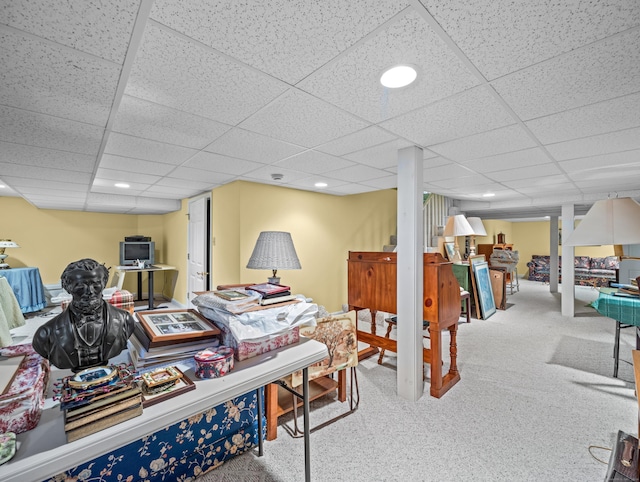 carpeted office featuring a drop ceiling