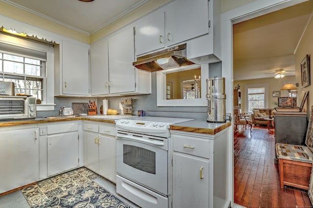 kitchen featuring white cabinets, white range with electric cooktop, a healthy amount of sunlight, and wood-type flooring