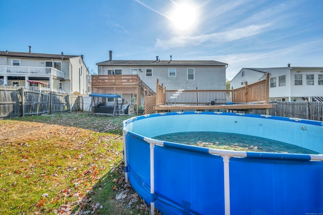 view of swimming pool featuring a deck