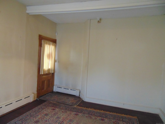 spare room with a baseboard heating unit