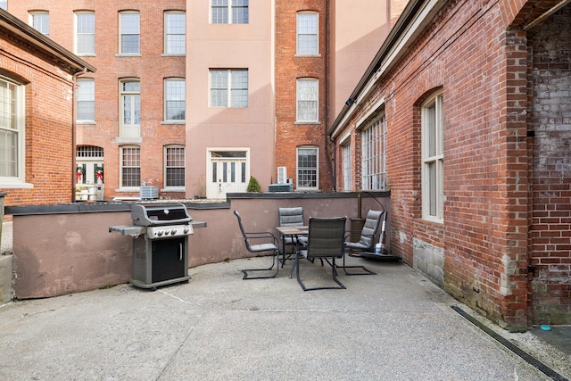 view of patio featuring a grill