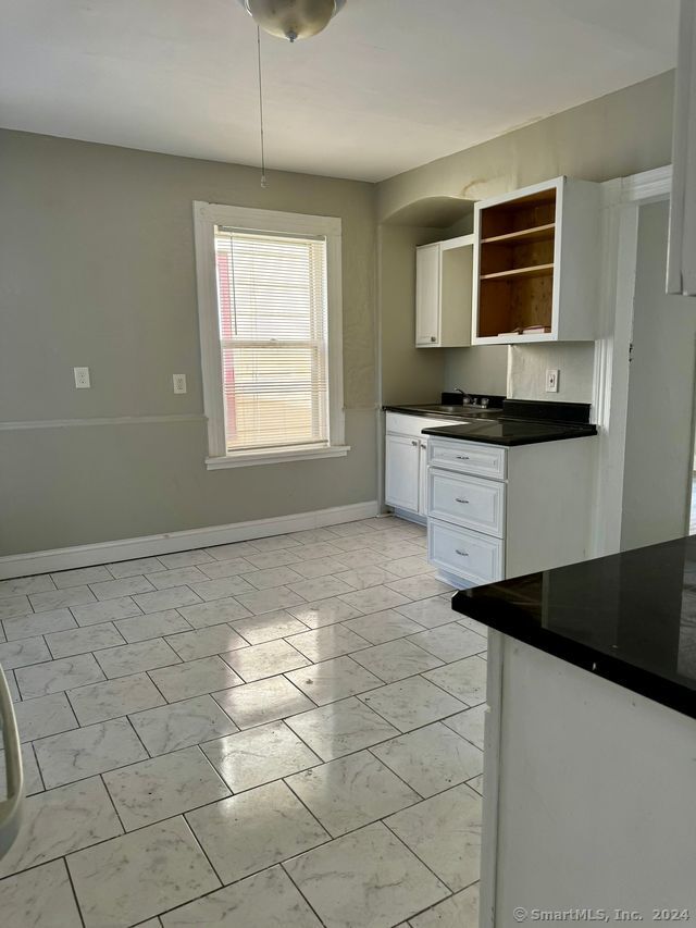 kitchen with white cabinets