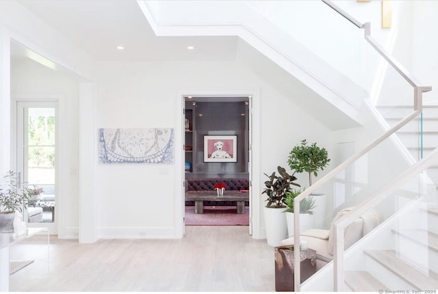 staircase featuring hardwood / wood-style floors