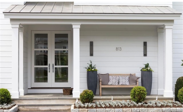 view of exterior entry featuring french doors