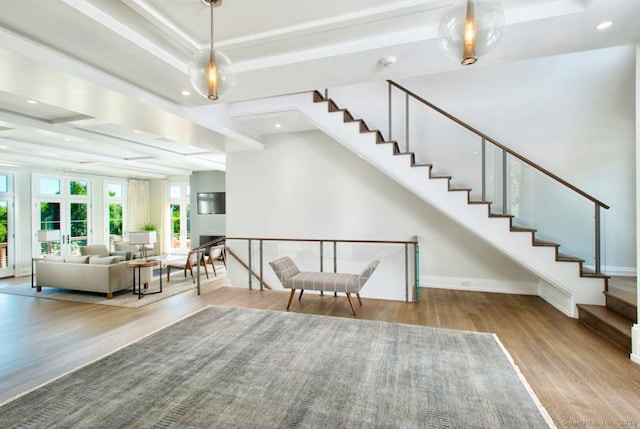 interior space featuring french doors, beamed ceiling, and hardwood / wood-style floors