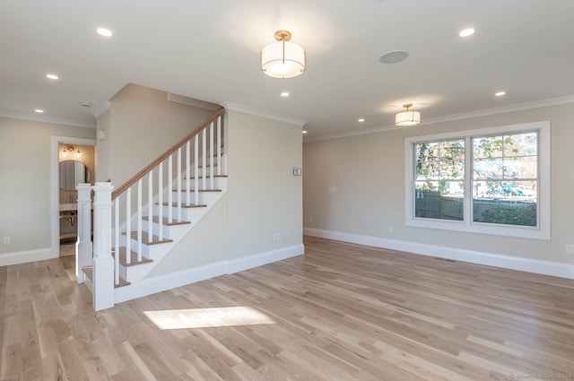 interior space featuring light hardwood / wood-style flooring and ornamental molding