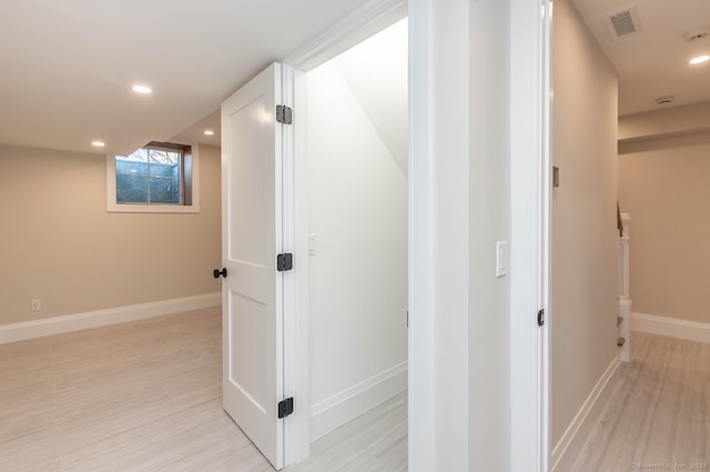 corridor featuring light hardwood / wood-style flooring