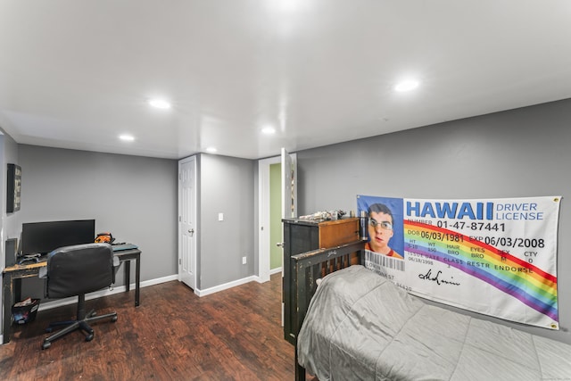 bedroom with dark hardwood / wood-style floors