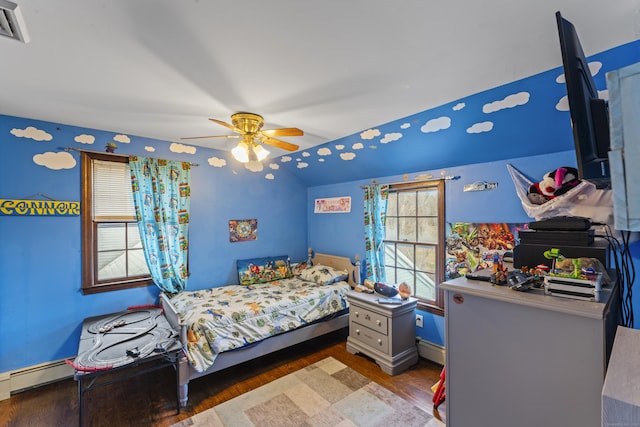 bedroom with hardwood / wood-style flooring, baseboard heating, and ceiling fan