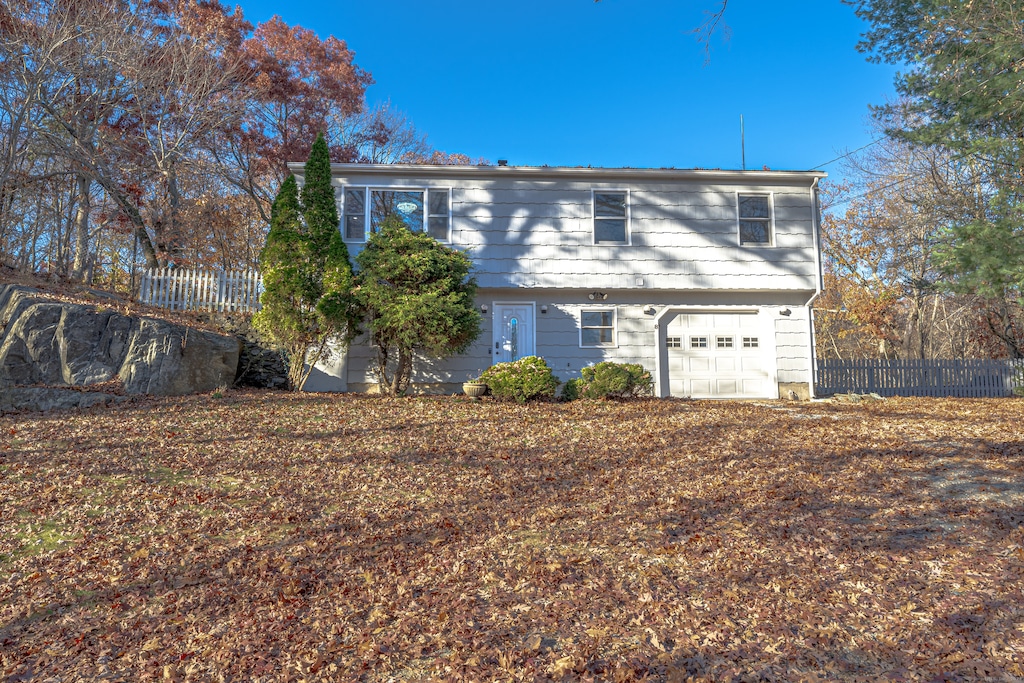 view of property exterior with a garage