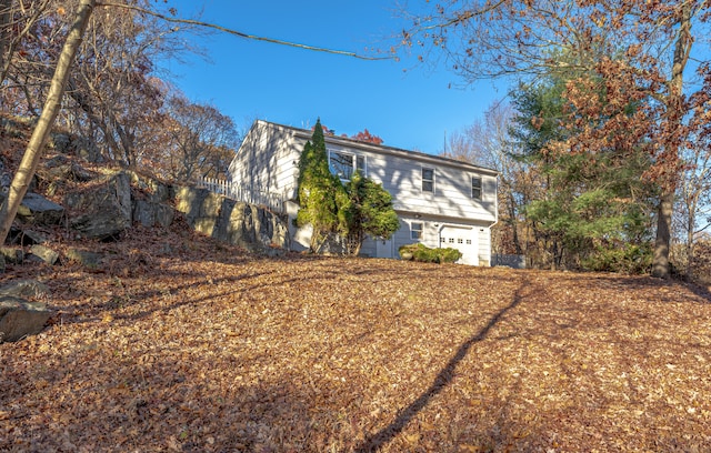 view of side of property with a garage