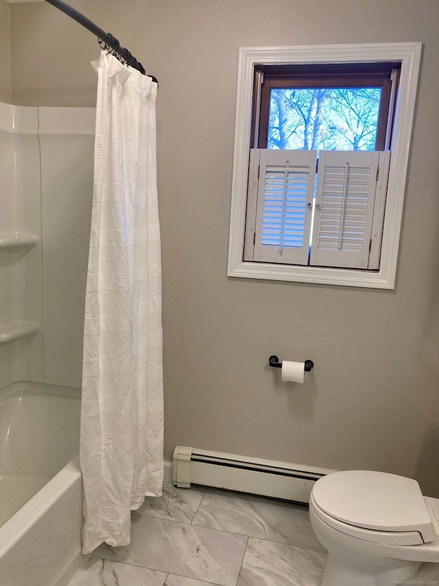 bathroom with a baseboard radiator, shower / bath combo, and toilet