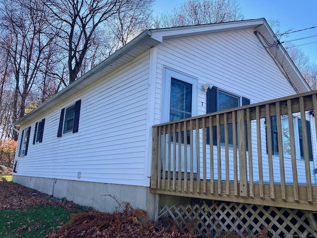 view of home's exterior featuring a deck