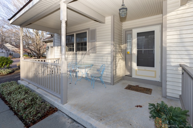 view of exterior entry with covered porch