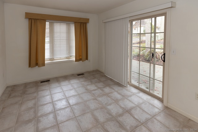 view of tiled spare room