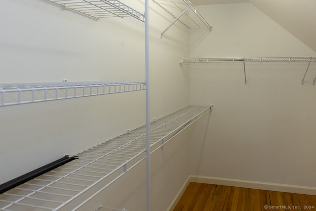 spacious closet featuring hardwood / wood-style flooring