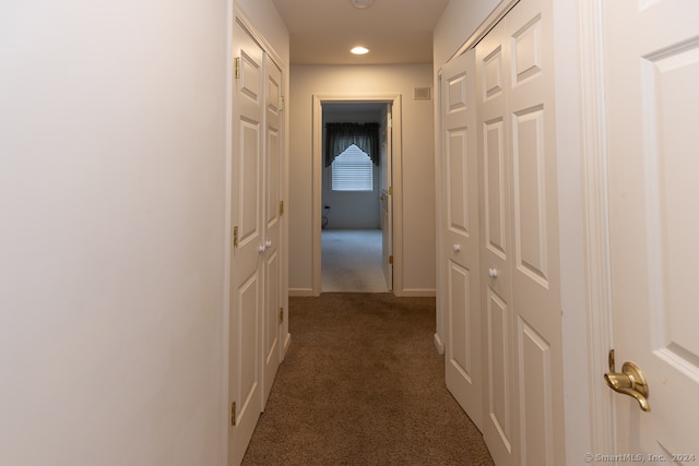 corridor with dark carpet