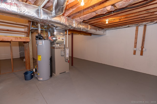 basement featuring gas water heater and heating unit