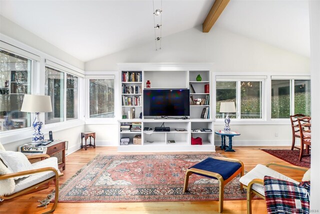 living room with lofted ceiling with beams and wood-type flooring