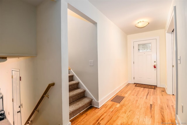 doorway with light hardwood / wood-style floors