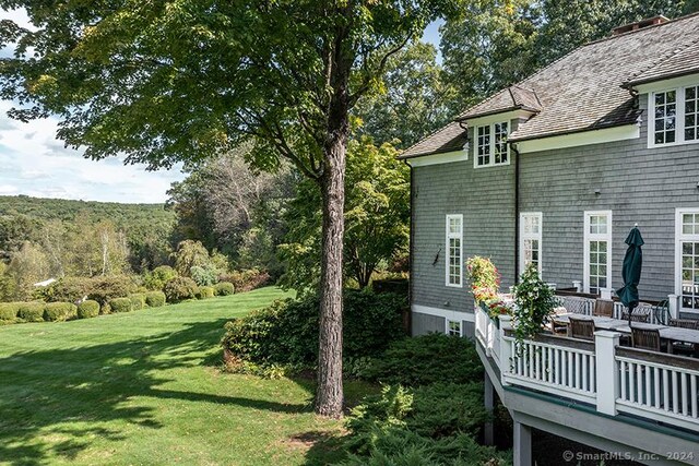 view of yard featuring a wooden deck