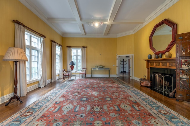 living area with beam ceiling, a fireplace, wood finished floors, coffered ceiling, and baseboards