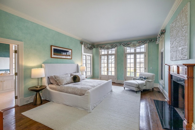 11 Ravenrock Rd, Roxbury, CT 06783 - bedroom with wood-type flooring, ornamental molding, a fireplace with flush hearth, and baseboards