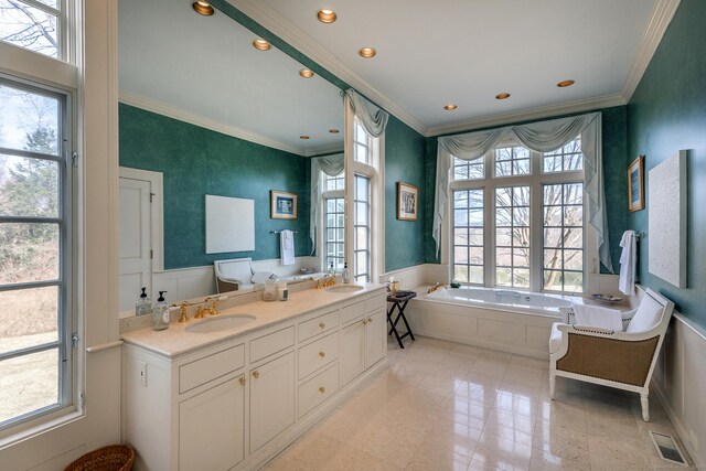 11 Ravenrock Rd, Roxbury, CT 06783 - bathroom with crown molding, a bath, recessed lighting, double vanity, and a wainscoted wall