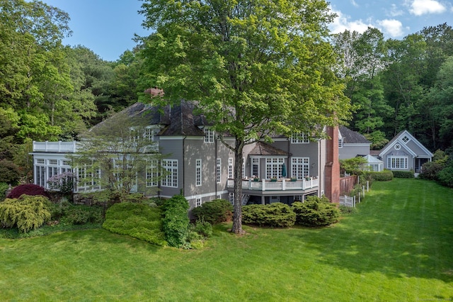 11 Ravenrock Rd, Roxbury, CT 06783 - back of house with a lawn, a wooden deck, and a chimney