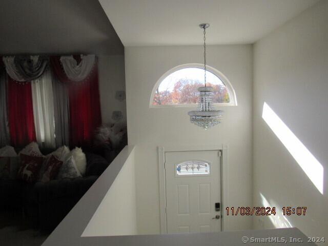 foyer with a notable chandelier