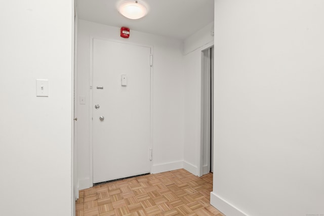 hallway with light parquet flooring