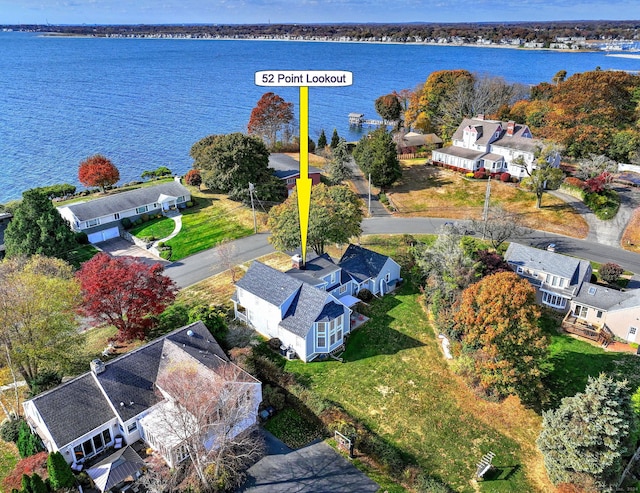 birds eye view of property with a water view