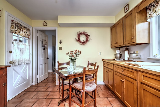 dining space with light tile patterned floors