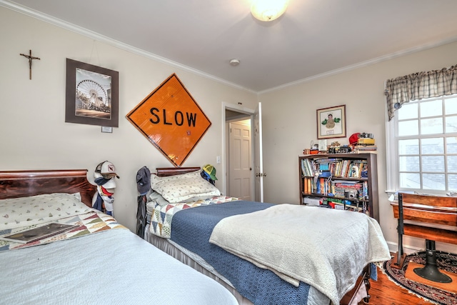 bedroom with ornamental molding