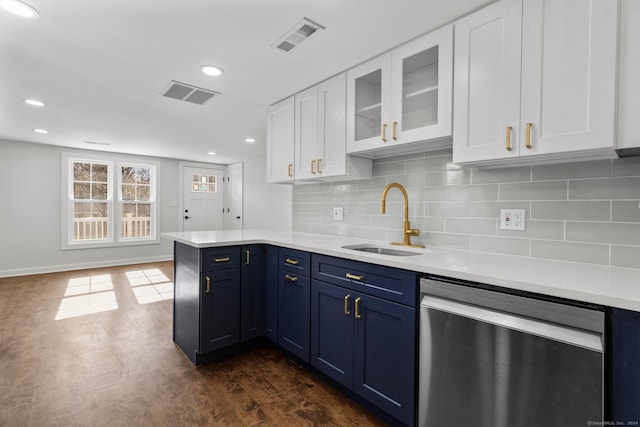 kitchen featuring blue cabinetry, dark hardwood / wood-style floors, sink, white cabinets, and dishwasher