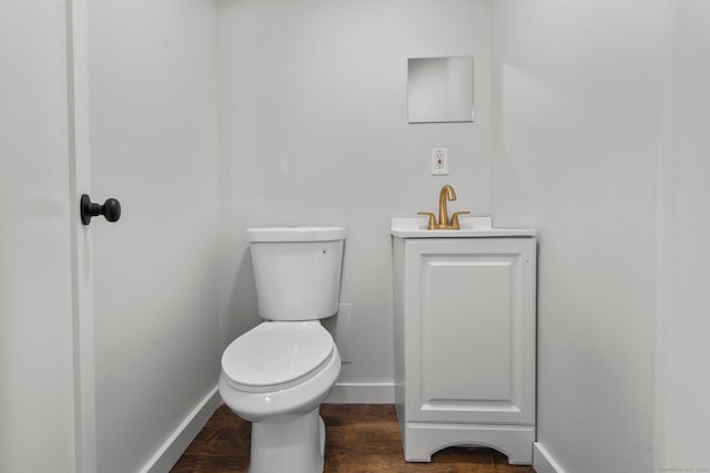 bathroom featuring hardwood / wood-style floors, vanity, and toilet